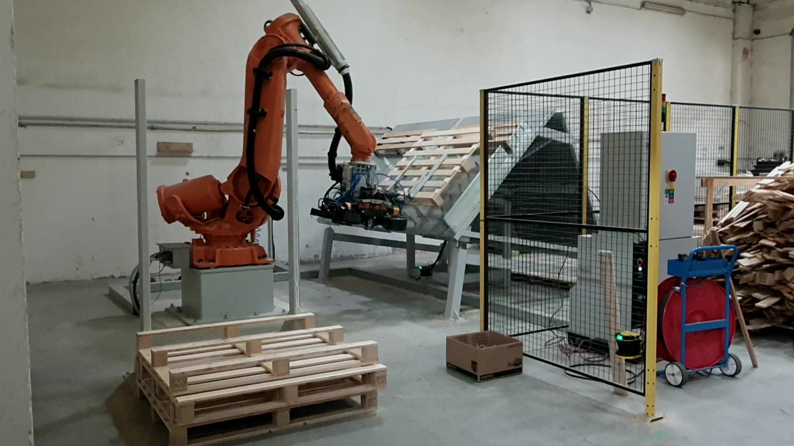 Industrial Automation — Clean modern robotic arm or automation cell in production